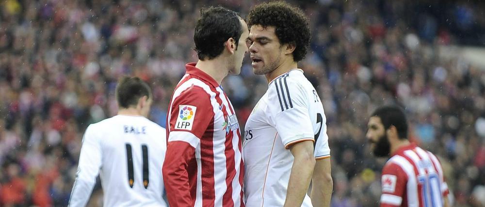 Auge um Auge. Atlético und Real (hier Diego Godin und Pepe) sind in diesem Jahr in Spanien und in Europa Titelaspiranten.