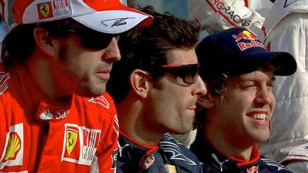 Fernando Alonso (links) hatte vor dem Rennen die besten Chancen auf den Titel, Mark Webber (Mitte) lag dahinter vor dem Deutschen Sebastian Vettel. Der galt eigentlich nur als Außenseiter.