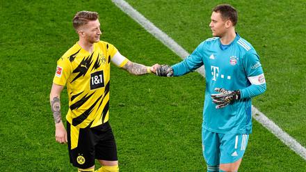 Faust drauf. Dortmunds Kapitän Marco Reus (l) begrüßt Bayerns Kapitän und Torhüter Manuel Neuer vor dem Spiel. 