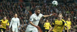 Karim Benzema (l.) trifft zweimal für Real, aber das ist nicht genug gegen kampfstarke Dortmunder.