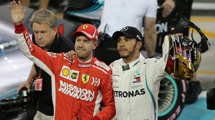 Arm in Arm. Vizeweltmeister Vettel und Weltmeister Hamilton freuen sich auf die Winterpause.