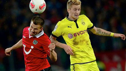 Konnten dem Spiel ihrer Mannschaft diesmal nicht ihren Stempel aufdrücken: Hannovers Szabolcs Huszti (l.) und Dortmunds Marco Reus.