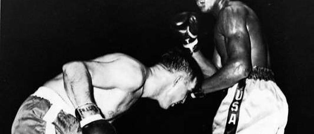 Auch der Größte war mal Amateur. Muhammad Ali (r.) bei einem Kampf im Jahr 1960, als er noch den Namen Cassius Clay trug. Foto: AP
