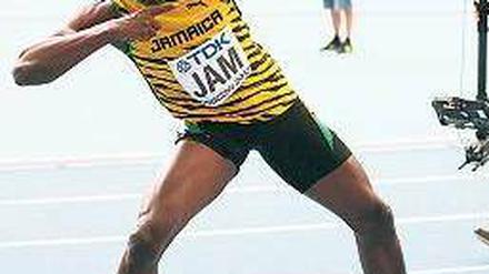 Mit Pfeil und Bolt. Die Inszenierung des jamaikanischen Weltrekordlers. Foto: dpa