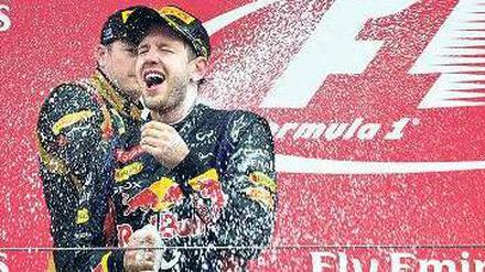 Im Überschwang. Sebastian Vettel kann sich derzeit selbst feiern. Foto: AFP
