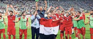 Ein Team, eine Flagge, ein gespaltenes Land. Die syrischen Spieler jubeln nach dem 2:2 gegen den Iran.