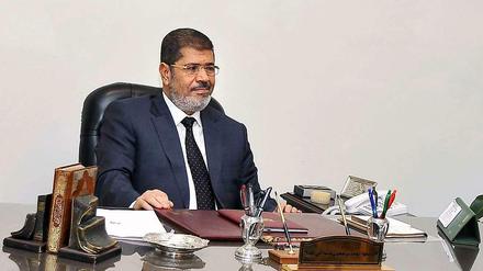 Staatspräsident Mursi will an dem umstrittenen Verfassungs-Referendum festhalten.