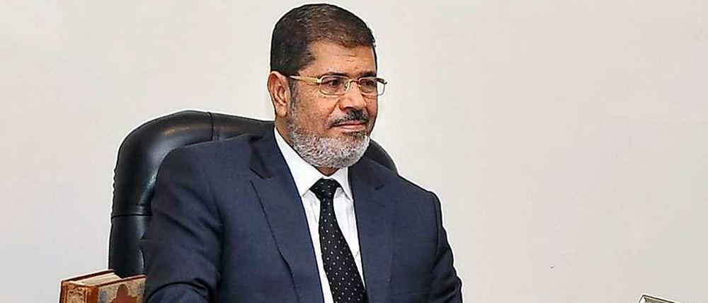 Staatspräsident Mursi will an dem umstrittenen Verfassungs-Referendum festhalten.