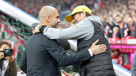 Jürgen Klopp (rechts) und Pep Guardiola könnten einige Bewegung in den Trainermarkt bringen.