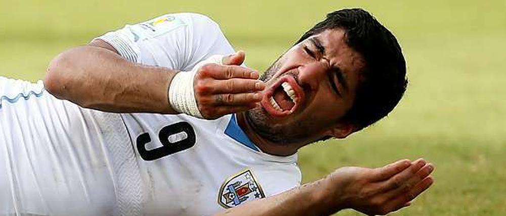 Schmerzhafter Biss. Luis Suarez muss die WM in Brasilien durch die Hintertür verlassen.