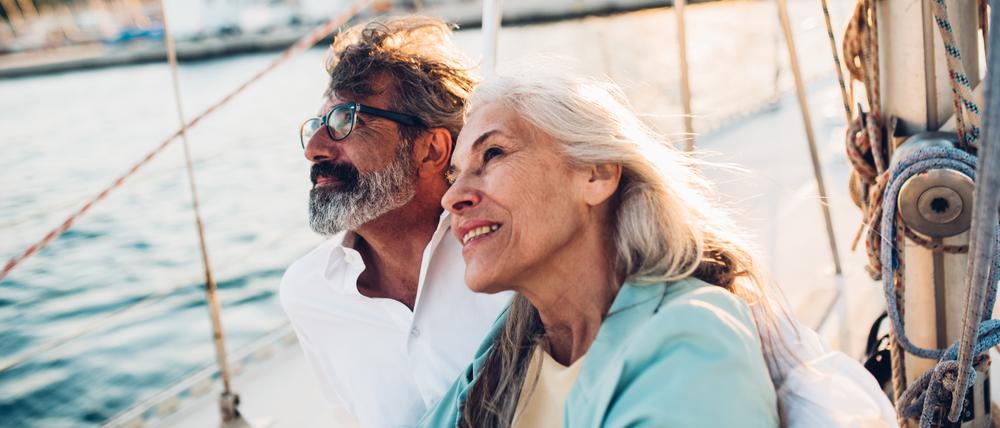 Portrait of a senior couple enjoying cruising on their yacht.
