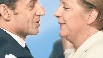Seltene Harmonie. Beim Verbieten von Leerverkäufen sind sich Frankreichs Präsident Nicolas Sarkozy und Bundeskanzlerin Angela Merkel ausnahmsweise mal einig. Foto: p-a/dpa