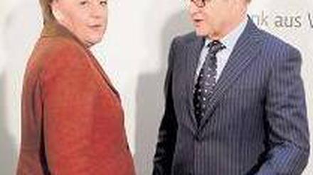 Viel Feind, viel Ehr. Angela Merkel und „Weisen“-Chef Wolfgang Franz. Foto: dpa