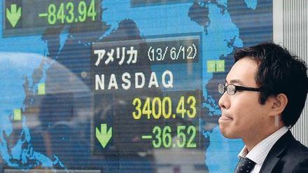 Lange Gesichter gab es am Donnerstag an der Tokioter Börse. In den vergangenen zwei Wochen hat der Nikkei-Index fast 20 Prozent verloren. 