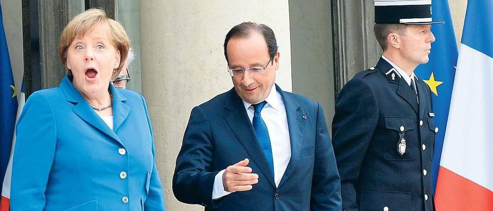 Oh lala! Angela Merkel wird es freuen, dass ihr wichtigster Partner François Hollande nun mit dem Sparen beginnen will. Foto: dpa