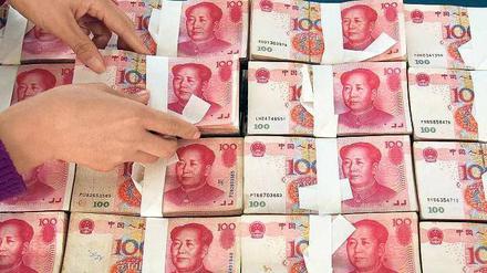 China tastet sich vor. Die Landeswährung Renminbi kann jetzt auch über die Drehscheibe Frankfurt am Main gehandelt werden. 