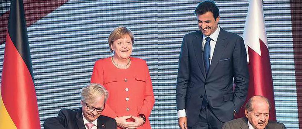 Paten gestanden. Angela Merkel und Tamim bin Hamad Al-Thani. 