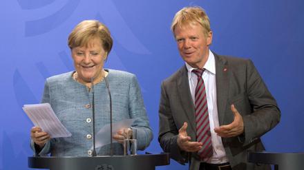 Sozialpartner: Bundeskanzlerin Angela Merkel und der DGB-Vorsitzende Reiner Hoffmann. 