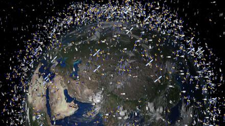  Das computergenerierte Bild der European Space Agency (ESA) zeigt Weltraummüll früherer Weltraummissionen, der neben intakten Satelliten um die Erde kreist. 
