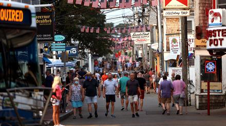 Provincetown, MA - July 20: Foot traffic along Commercial street in Provincetown, MA on July 20, 2021.  Provincetown officials have issued a new mask-wearing advisory for indoors regardless of vaccination status on the latest news data showing that Provincetown COVID cases are increasing. (Photo by Barry Chin/The Boston Globe via Getty Images)