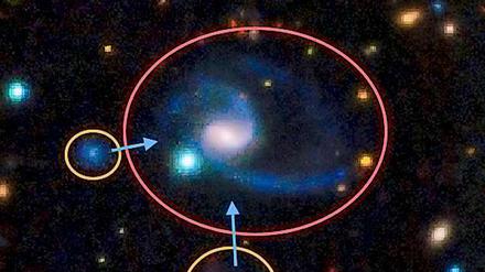 Diese Aufnahme zeigt einen der beiden "Zwillinge" des Milchstraßen-Systems. Die zentrale Galaxie (GAMA202627) ist ähnlich der Milchstraße und hat zwei größere Begleiter, ähnlich den Magellanschen Wolken in unserer kosmischen Nachbarschaft.