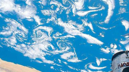 Weißes Rätsel. Kosmische Strahlen können die Wolkenbildung verstärken. Aufnahme des „Hubble“-Teleskops. Foto: AFP