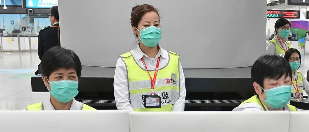 Temperaturkontrolle am Flughafen Honkong: Viele befürchten, dass sich das Virus weiter ausbreitet. 