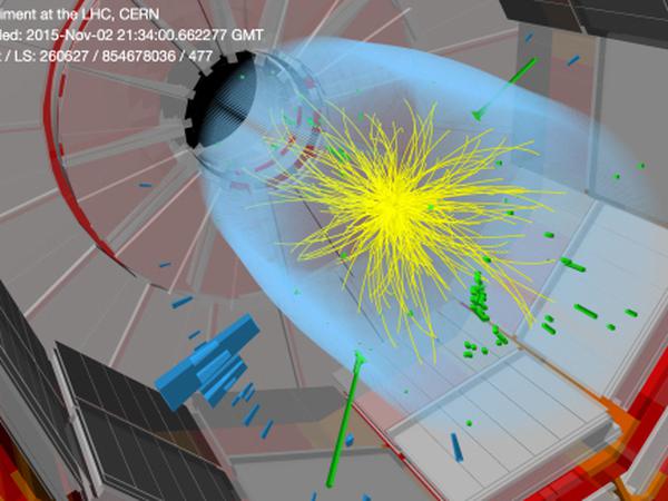 Photonenpaar. Die Abbildung zeigt, wie aus den Zusammenstößen der Partikel im CMS-Detektor unter anderem Photonenpaare (grün) hervorgehen. 